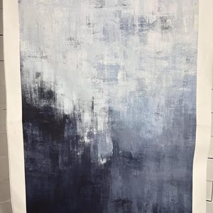 May include: Abstract art print with a textured, layered effect. The artwork transitions from deep navy at the bottom to lighter shades of gray and white at the top, creating a sense of depth and movement. The piece is mounted on a white paper.