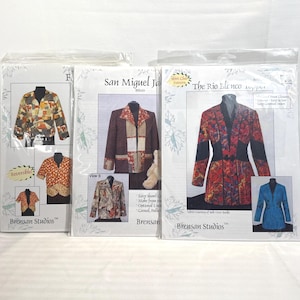 May include: Three sewing pattern packets for jackets, including reversible and shawl collar designs. The packets show images of the finished garments in various colours and patterns. The "Brensan Studios" logo is visible on the packets.