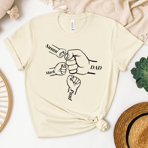Custom Fist Bump Dad T-Shirt, Father&#39;s Day Gift, New Dad Gift, Dad Shirt With Kids Names, Papa Hand with Kid Name, Personalized Grandpa Tee,
