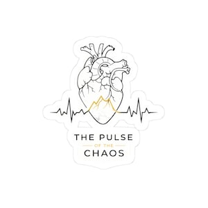May include: A white sticker featuring a black and gold illustration of a human heart with a mountain range inside. A gold pulse line runs through the heart. The text "THE PULSE OF THE CHAOS" is below the heart.