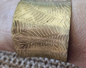 Vintage brass cuff bracelet with leaf or feather etching