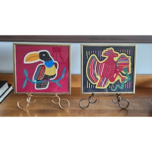 Pair of framed Mola art birds