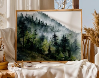 May include: A framed watercolor painting of a misty forest scene. The artwork features a hillside covered in evergreen trees, rendered in shades of green and gray. The wooden frame adds a natural touch to the artwork, which is displayed on a white surface.