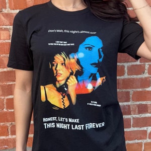 May include: Black t-shirt featuring a movie poster design with the text "Don't Wait, this night's almost over" and "Honest, Let's Make This Night Last Forever". The graphic includes two women in a colorful design.