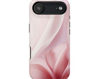 May include: A phone case with a soft pink and white floral design. The case has a black camera lens cutout and black side buttons. The overall aesthetic is delicate and feminine, with a focus on the flowing, petal-like patterns.