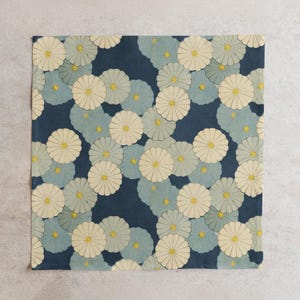 Square cloth featuring a traditional Japanese floral pattern with cream and pale blue flowers on a deep navy background. Ideal for Furoshiki wrapping, gift presentation, or decorative use.