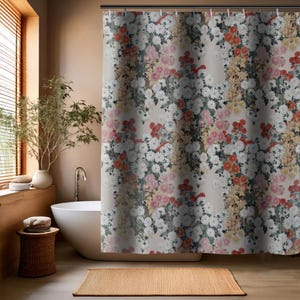 May include: A shower curtain with a floral pattern featuring white, pink, and red flowers on a beige background.
