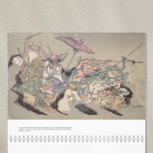 May include: A calendar featuring a colorful illustration of a procession of mythical creatures. The artwork includes a one-eyed goddess, reptilian monsters, and a Buddhist guardian. The text at the bottom describes the scene.