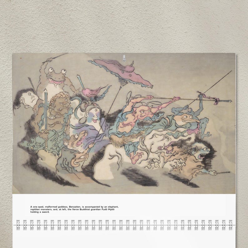 May include: A calendar featuring a colorful illustration of a procession of mythical creatures. The artwork includes a one-eyed goddess, reptilian monsters, and a Buddhist guardian. The text at the bottom describes the scene.