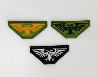 Toppa ricamata con aquila e chiusura in velcro in pile nero