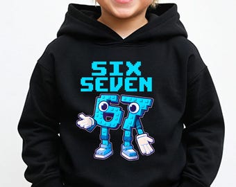 May include: Black hooded sweatshirt with the words "SIX SEVEN" in bright blue pixelated font. Below the text is a cartoon figure of the numbers 67, also in blue, with arms, legs, and smiling face. The sweatshirt is worn by a child.