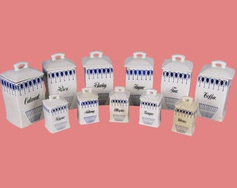 Juego de 11 botes para especias vintage C A W Germany, azules y blancos, con tapas.