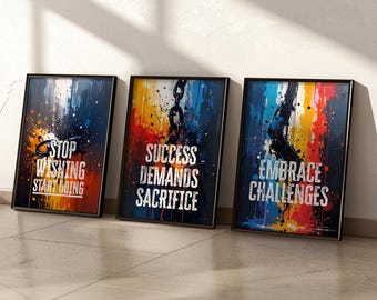 May include: Three framed art prints with motivational quotes. The first print reads "STOP WISHING START DOING" with orange and blue splashes. The second print says "SUCCESS DEMANDS SACRIFICE" with red, yellow, and blue. The third print says "EMBRACE CHALLENGES" with a colourful design.