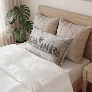 May include: A rectangular pillowcase featuring a beige and brown vintage-style map background with a horizontal line of dark, detailed illustrations of various mythical creatures and monsters printed across the center of the fabric surface.