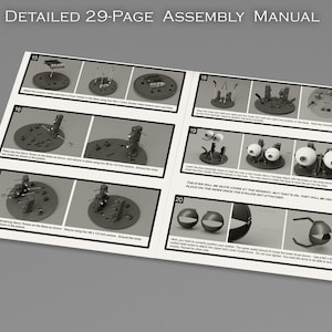 May include: A black and white assembly manual with numbered steps for building a robot. The manual includes detailed instructions and illustrations for attaching the robot's eyes, arms, and other parts.