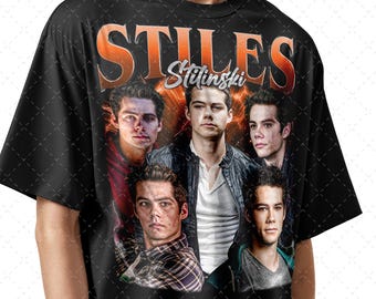 May include: Black t-shirt with a graphic print of four men's faces. The text "Stiles Stilinski" is printed in orange and white on the shirt.