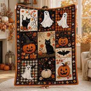 May include: A rectangular throw blanket featuring a patchwork design of Halloween motifs including black cats, white ghosts, orange pumpkins, and bats. The pattern incorporates autumn leaves, black and orange plaid, and cream backgrounds.