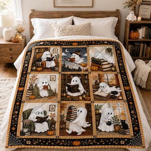 May include: A quilt featuring nine panels with white ghost characters in various autumn scenes, including reading books, drinking from mugs, and carrying stacks of books. The border is black with orange pumpkins and spider web patterns.