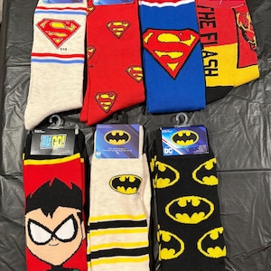 DC Comics Superman & Batman Socks – Official Licensed Superhero Crew Socks – Gift for Him – Comic Book Fan Socks – Geeky Novelty Socks