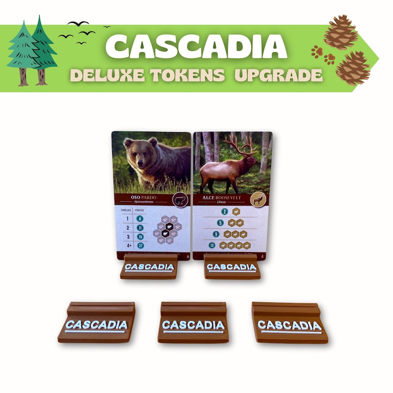Puede incluir: Componentes del juego Cascadia Deluxe Tokens Upgrade. La imagen muestra dos cartas de animales con ilustraciones de osos y alces, junto con soportes de fichas marrones. El t&iacute;tulo del juego y la informaci&oacute;n de actualizaci&oacute;n se muestran en texto verde y blanco.