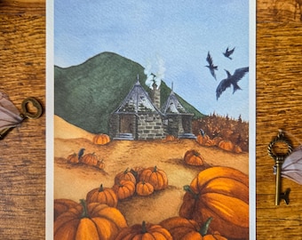 May include: Watercolor print featuring a landscape with pumpkins, a stone building, and a green hill under a blue sky. Several orange pumpkins are in the foreground, with more in the field. Three black birds fly in the sky.