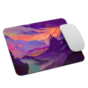 May include: A rectangular mousepad featuring a vibrant landscape painting with a castle silhouette. The artwork showcases a sunset with shades of purple, orange, and pink. A white wireless mouse is placed on the right side of the mousepad.