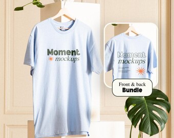 May include: A light blue t-shirt with the text "Moment mockups" in dark green and orange. The t-shirt is displayed on a white surface with a plant in the background. The text "Front & back Bundle" is displayed in a white rectangle on a black background.
