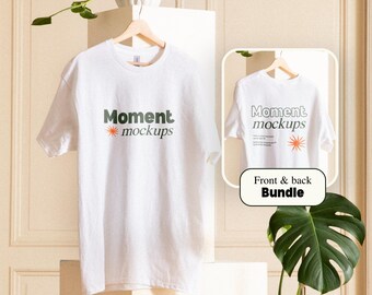 May include: White t-shirt mockup with the text "Moment mockups" printed on the front and back. The t-shirt is hanging on a hanger against a white background.