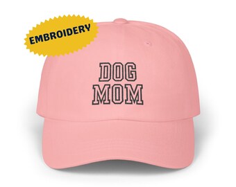 May include: Pink baseball cap with black embroidered text that reads "DOG MOM".