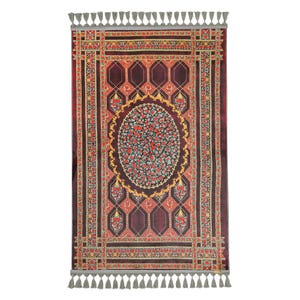 May include: A rectangular prayer rug featuring a deep burgundy background with a central oval medallion filled with intricate red and blue floral patterns. The border displays geometric motifs and floral accents, finished with grey tassels on both ends.
