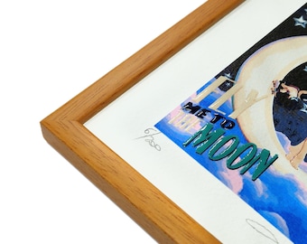 May include: A framed print of a colourful illustration with a woman standing on a crescent moon. The text "Fly Me To The Moon" is written in green and blue letters. The print is signed and numbered 6/200.