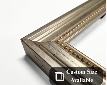 Crafted with an elegant wooden design, this hand-silvered Baroque photo frame is a unique decor accent for posters and home interiors