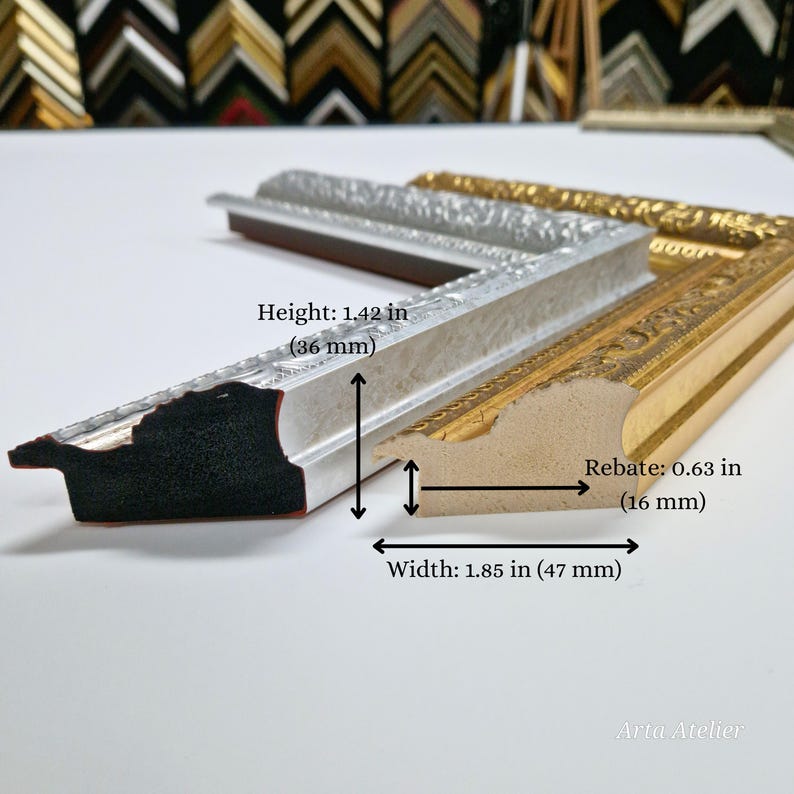 May include: Close-up of a silver and gold picture frame with ornate details. The frame is 1.85 inches wide and 1.42 inches high. The rebate is 0.63 inches.