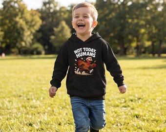 May include: A black hooded sweatshirt featuring a graphic of a running turkey wearing a headband and sneakers, with the text "NOT TODAY, HUMANS" printed in white above the turkey, accompanied by scattered autumn leaves and dust clouds.