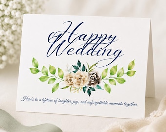May include: A white folded greeting card featuring the dark blue text Happy Wedding at the top, followed by a watercolor illustration of beige and dark roses with green leaves, and the text Here's to a lifetime of laughter, joy, and unforgettable moments together.