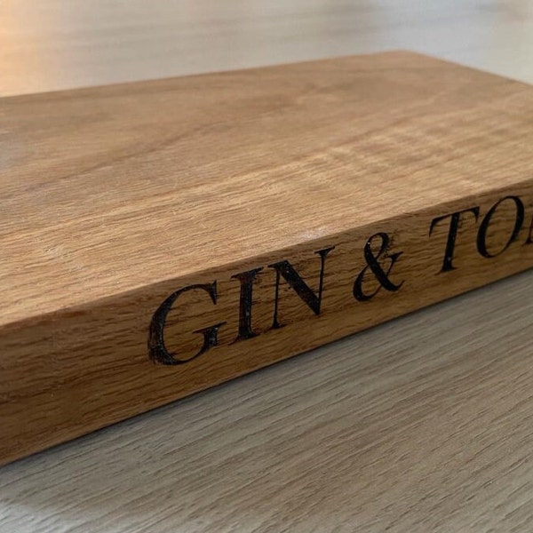 Gin & Tonic Prep Board. Solid English oak, Engraved detail to edge. 4 rubber feet to base. Sealed with chopping board oil. Very high quality