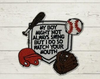 May include: An embroidered patch shaped like a home plate with the text MY BOY MIGHT NOT ALWAYS SWING BUT I DO SO WATCH YOUR MOUTH. It features a black baseball bat, a white baseball with red stitching, a red batting helmet, and a brown baseball glove.