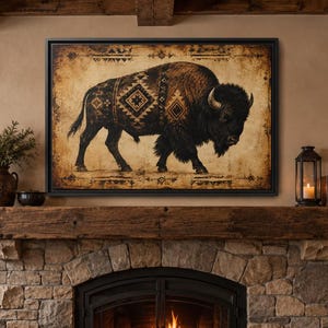 May include: A rectangular wall art print featuring a dark brown bison illustration with geometric patterns on its side, set against a distressed, aged parchment-colored background with decorative border elements, framed in a thin black frame.