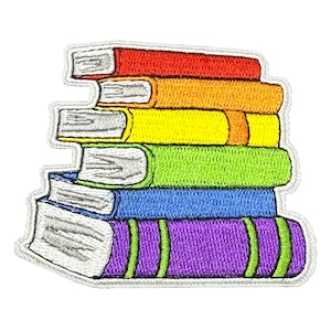 May include: A stack of six embroidered books in rainbow colours, with the bottom book being purple, the next blue, then green, yellow, orange, and red on top.