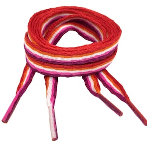 May include: A pair of red, orange, white and pink striped shoelaces. The shoelaces are tied together in a loop.