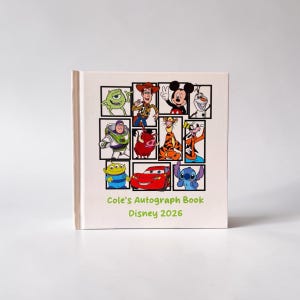 May include: A light beige autograph book featuring a grid of Disney character illustrations. The cover includes characters like Mickey Mouse, Woody, and Stitch. The text "Cole's Autograph Book Disney 2026" is printed in green.