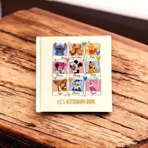 May include: A cream-colored autograph book featuring nine Disney character illustrations in a grid. Characters include Stitch, Chip & Dale, Winnie the Pooh, Minnie Mouse, Mickey Mouse, Pluto, Tigger, Donald Duck, and Piglet. The text "EC'S AUTOGRAPH BOOK" is printed on the cover.