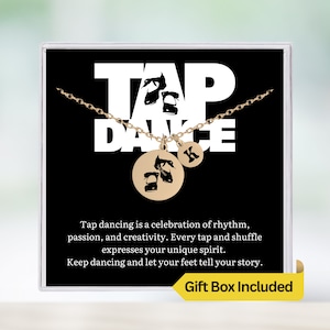 May include: Gold necklace with a tap dancing shoe charm and a letter K charm. The necklace is in a black gift box with the words "Tap Dance" and a quote about tap dancing. The box also says "Gift Box Included".