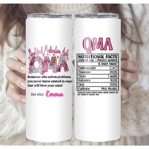 May include: A white tumbler with a pink design that says "Qualified Medication Aide" and "OMA" with a floral pattern. The other side of the tumbler has a pink design that says "OMA" and "Nutritional Facts" with a list of qualities and their daily values.