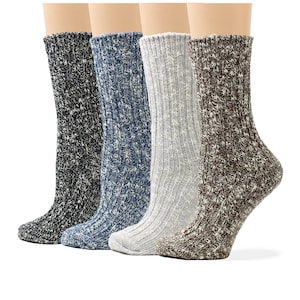 May include: Four pairs of ribbed knit socks in various colors: black, blue, gray, and brown. The socks are displayed on mannequin legs, showcasing their texture and design. The socks appear to be made of a thick, warm material.