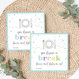 May include: Two printable gift tags with a blue background and colorful confetti. The tags feature a line drawing of a plate, fork, and knife with the text "you deserve a break, dinner and dishes on us!" and "From:"