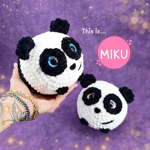 May include: Two crocheted panda plushies, one white with black markings and blue eyes, the other white with black markings and pink eyes. The text "This is...Miku" is in a pink circle.