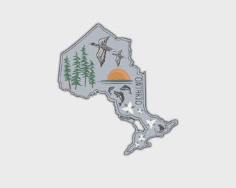 May include: A light gray sticker shaped like the province of Ontario featuring a graphic of green pine trees, two flying geese, a setting orange sun over water, three jumping fish, and white trillium flowers with the word ONTARIO printed vertically.