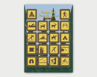 May include: A sticker sheet titled Vintage Park Recreation Symbols featuring twenty square icons with yellow backgrounds and brown borders. The icons depict outdoor activities like hiking, camping, swimming, and fishing against a forest background.