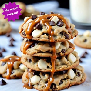 May include: A stack of four chocolate chip cookies with white chocolate chips, drizzled with caramel sauce. The cookies are on a white surface with chocolate chips scattered around them. The text "No mixer needed!" is in a purple starburst shape.